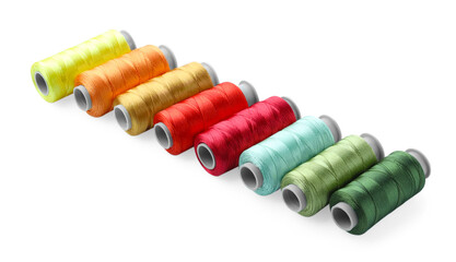 Spools of bright sewing threads isolated on white