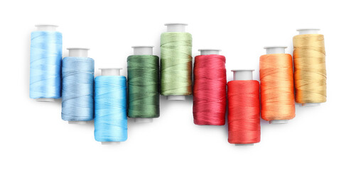 Spools of bright sewing threads isolated on white, top view