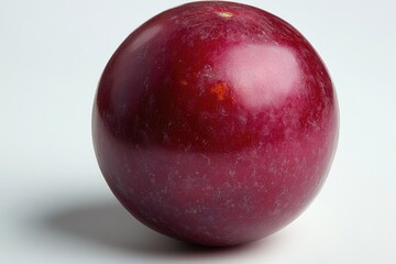 Obraz premium A close-up shot of a bright red apple on a white background