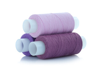 Spools of bright sewing threads isolated on white