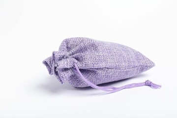 One violet burlap sack on white background