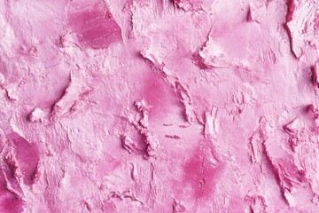 A close-up shot of pink paint on a wall