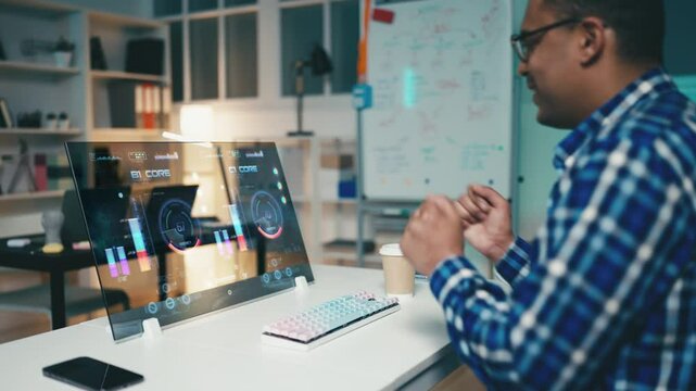 Programmer celebrates the successful launch of a program on futuristic computer