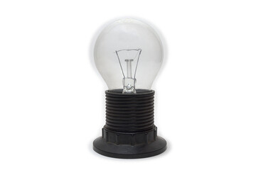 incandescent traditional shape clear glass light bulb, installed in vintage lampholder with shade ring on end of threaded shell. isolated on white background, with clipping path