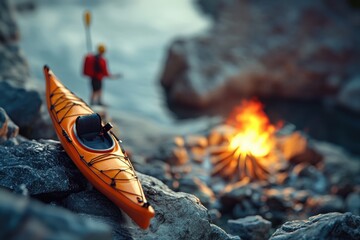 Obraz premium A kayak sitting on top of a rock next to a campfire, perfect for outdoor enthusiasts and nature lovers
