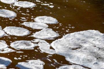 ice formations in a wild river, beautiful frozen ice formations from the interaction of water, flow and frost, Raunis, Latvia