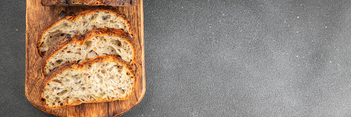 Grain bread sunflower, chia, flax seed, cut oats fresh tasty food dish delicious gourmet food background on the table rustic food top view copy space vegetarian and vegan food