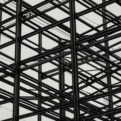 Fototapeta premium Intricate steel framework against overcast sky