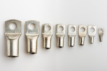 Crimp terminals for electrical wires, tools for electricians. electrical terminals, electrical installation work on white. Connectors for wires.