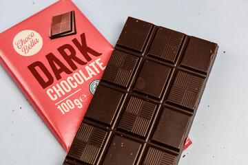 Delicious dark chocolate bar with the inscription Dark Chocolate. Healthy eating concept