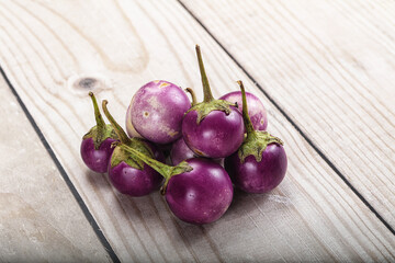 Raw small purple asian baby eggplant