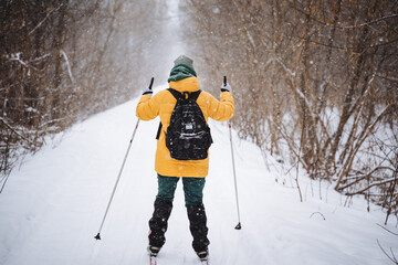 A person is actively engaged in cross country skiing through the beautiful snowcovered landscape...