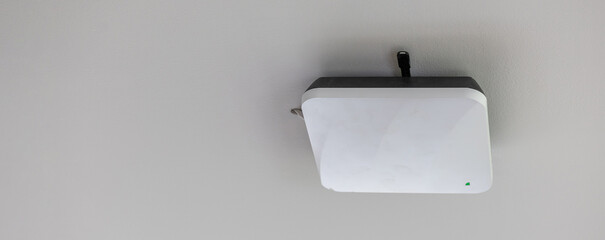 wireless router for network, hang on the ceiling. world wide network technology. WIFI router or...