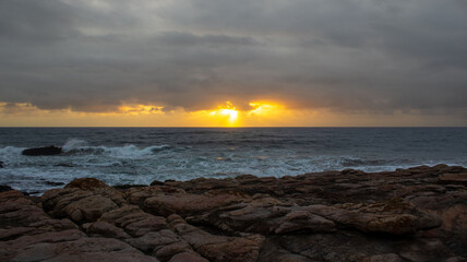 Sunrise over the ocean, located at Orange Rocks in Uvongo in Margate, South Africa