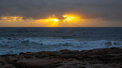 Sunrise over the ocean, located at Orange Rocks in Uvongo in Margate, South Africa