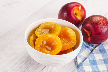 Canned peaches with sweet syrope
