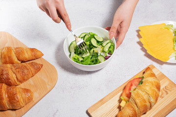 Healthy Breakfast with Salad and Croissants