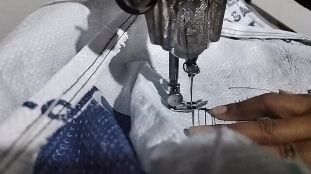 Person Sewing with a Sewing Machine