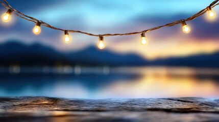 Fototapeta premium A string of light bulbs hanging over a body of water