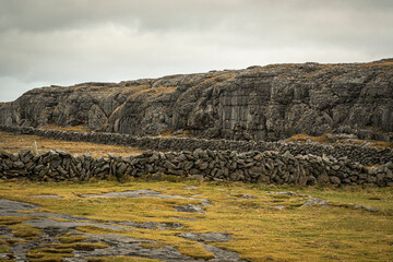 dry stone desert with rock wall