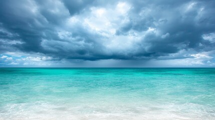  a beach with a cloudy sky in the background The water is a deep blue and the sand is a light tan color The sky is filled with dark, ominous clouds, creating a dra