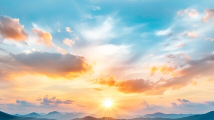 Fototapeta premium a beautiful sunset with the sun setting over the mountains in the background The sky is a mix of vibrant oranges, pinks, and purples, and the clouds are illuminate