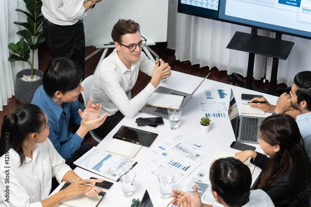 Leinwandbilder Project manager communicate and collaborate with team using project management software display on monitor, tracking progress of project task and making schedule plan at meeting table. Prudent