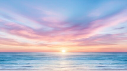 Fototapeta premium a beautiful sunset over the ocean with the sun setting in the sky, surrounded by clouds The colors of the sky are a mix of oranges, pinks, and purples, creating a