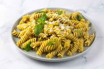 Italian Fusilli Pasta and Pesto. Fusilli pasta, basil and herbs, parmesan cheese, basil and garlic