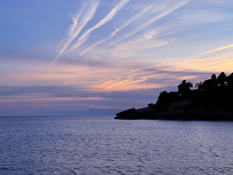 Calm sea and sunrise sky in early morning.