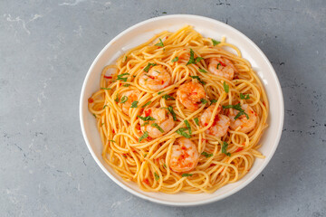 Delicious shrimp spaghetti with tomato sauce and parsley, Italian cuisine