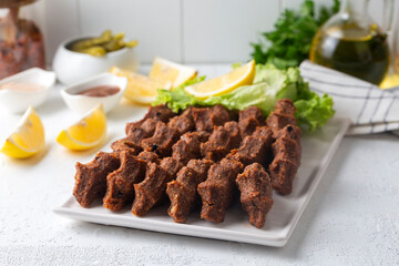 Traditional delicious Turkish food; Turkish name; Cig kofte (raw meatball in Turkish) with lettuce