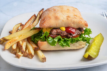 hamburger  top with mustard and ketchup
