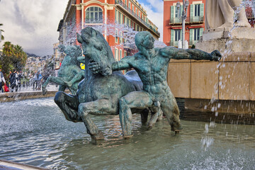 Famous Fontaine du Soleil Fountain of the Sun in Place Massena in Nice, France.