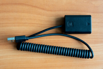 Battery adapter with USB connector for powering the camera