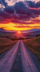 Fototapeta premium Golden sunset rays illuminating a winding road through peaceful countryside