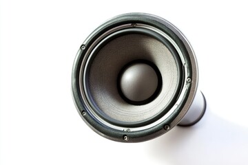 A close-up view of a speaker on a white surface
