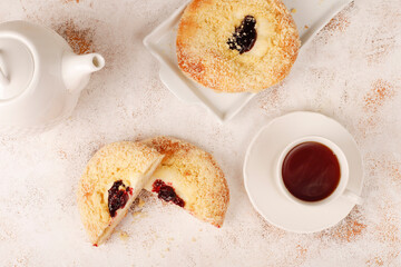Homemade vatrushki, Russian round pastry with cottage cheese and sour cherry jam.
