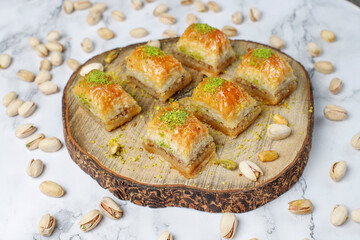 Turkish-style pistachio baklava with a glass of milk.