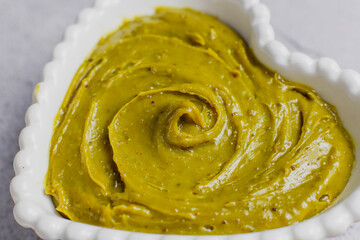 Delicious homemade pistachio paste or cream,spread with pistachios.