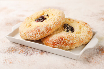 Homemade vatrushki, Russian round pastry with cottage cheese and sour cherry jam.