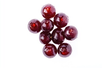 A bowl of ripe cherries on a white surface, ideal for food and still life photography