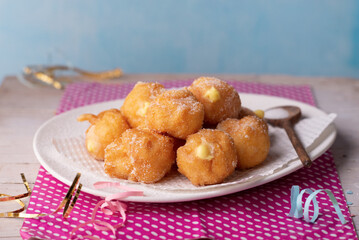 Brighelle, very soft fried sweets typical of Carnival and filled with various creams.