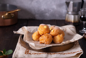 Brighelle, very soft fried sweets typical of Carnival and filled with various creams.