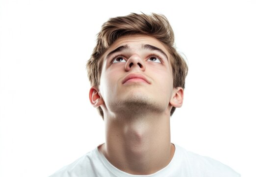A person gazing upwards, contemplating or thinking deeply about something