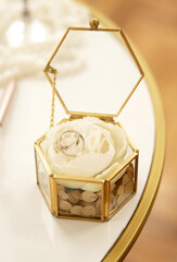 Wedding rings in a glass box close up