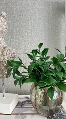 Modern Decor Arrangement With Green Plant In Mosaic Glass Vase And Wooden Bust On Shelf, Indoors, Contemporary Interior Concept, Ideal For Home Decor Businesses And Design Inspirations.