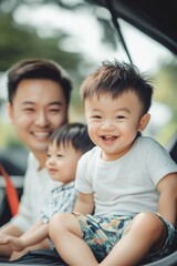 A man and a child sitting together in the back seat of a car