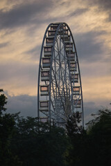 Big ferris wheel in Budapest, Hungary on a sunset sky background 