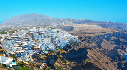 Fira capital of Santorini island, Greece . View of traditional white architecture of Santorini, Cyclades islands Aegean sea.
